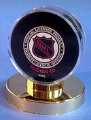 Acrylic Puck Holder with Gold Pedes